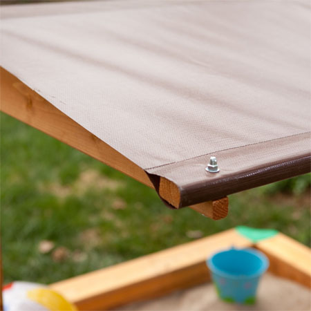 large covered wooden sandbox